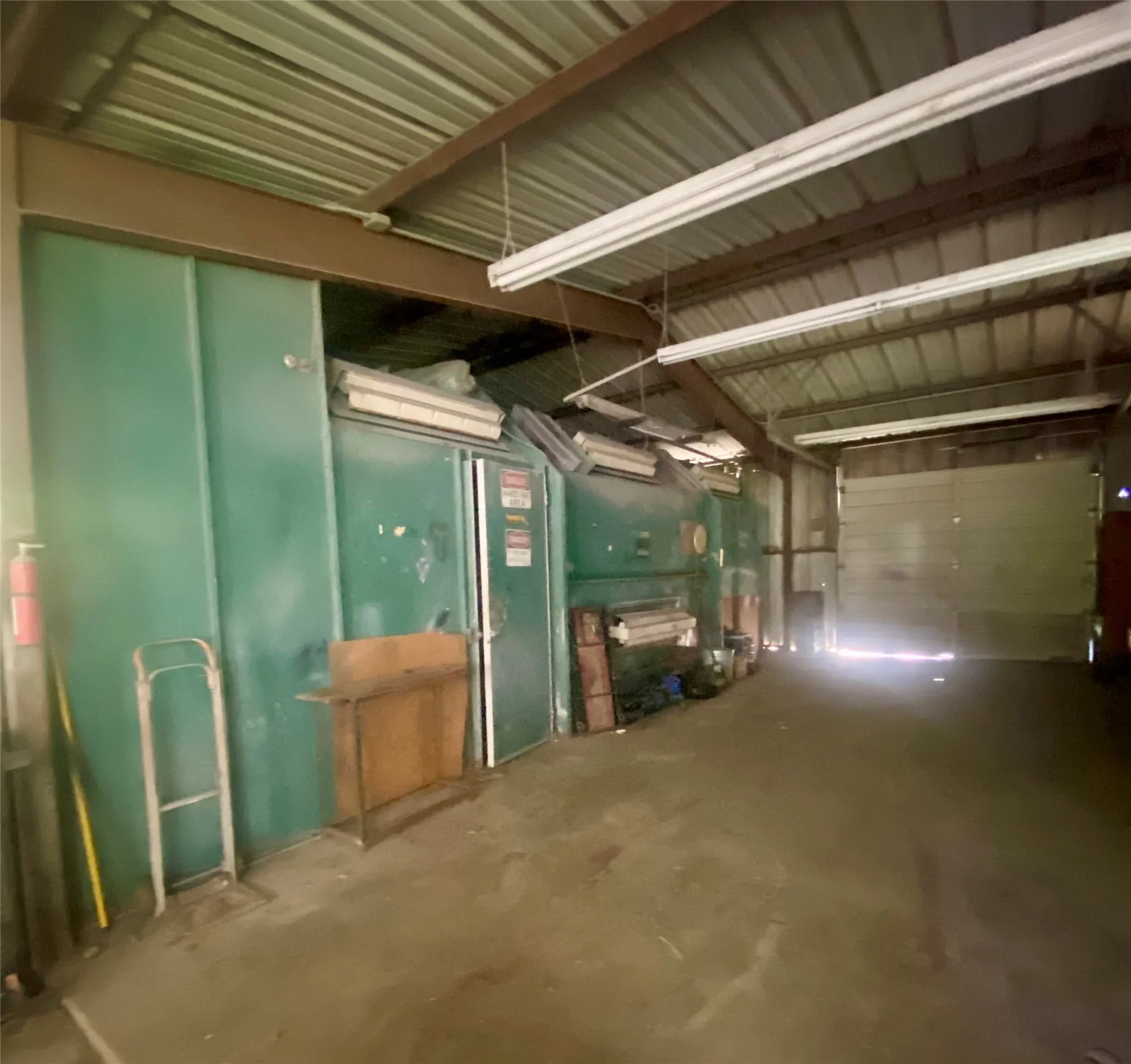 Garage area with paint booth in green