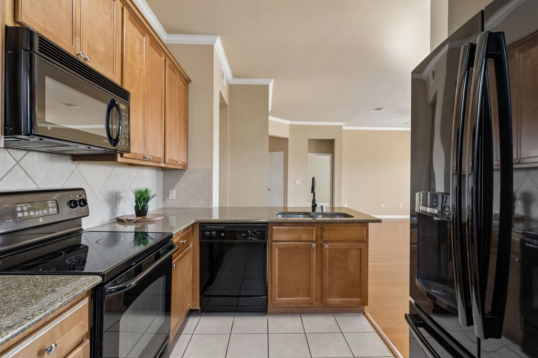 Granite countertops, abundant cabinetry, and convenient workspace make meal preparation a breeze!