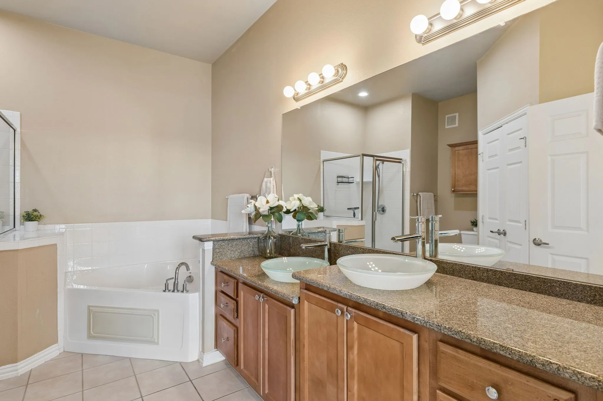 Two sinks, generous counter space, and room to get ready without feeling crowded!