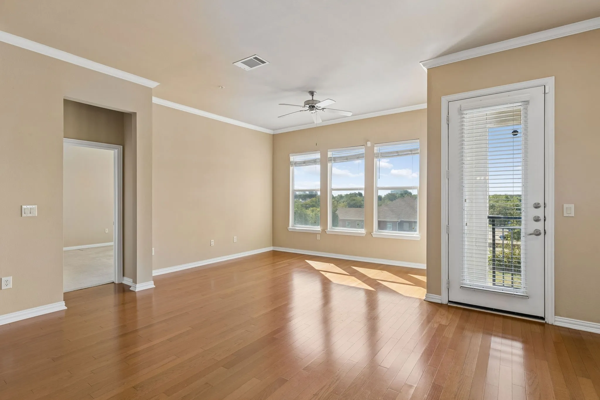 Beautiful wood flooring and natural light create a warm, welcoming atmosphere.