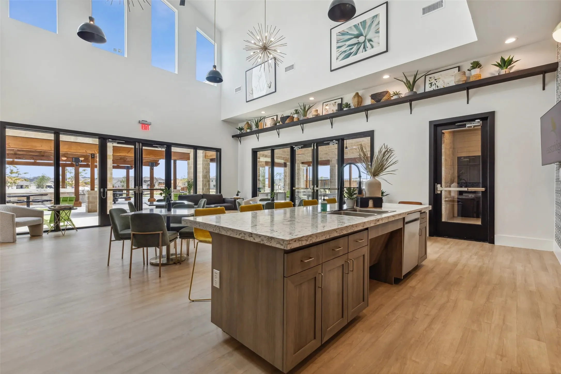 High ceilings with upper windows and pendant lighting