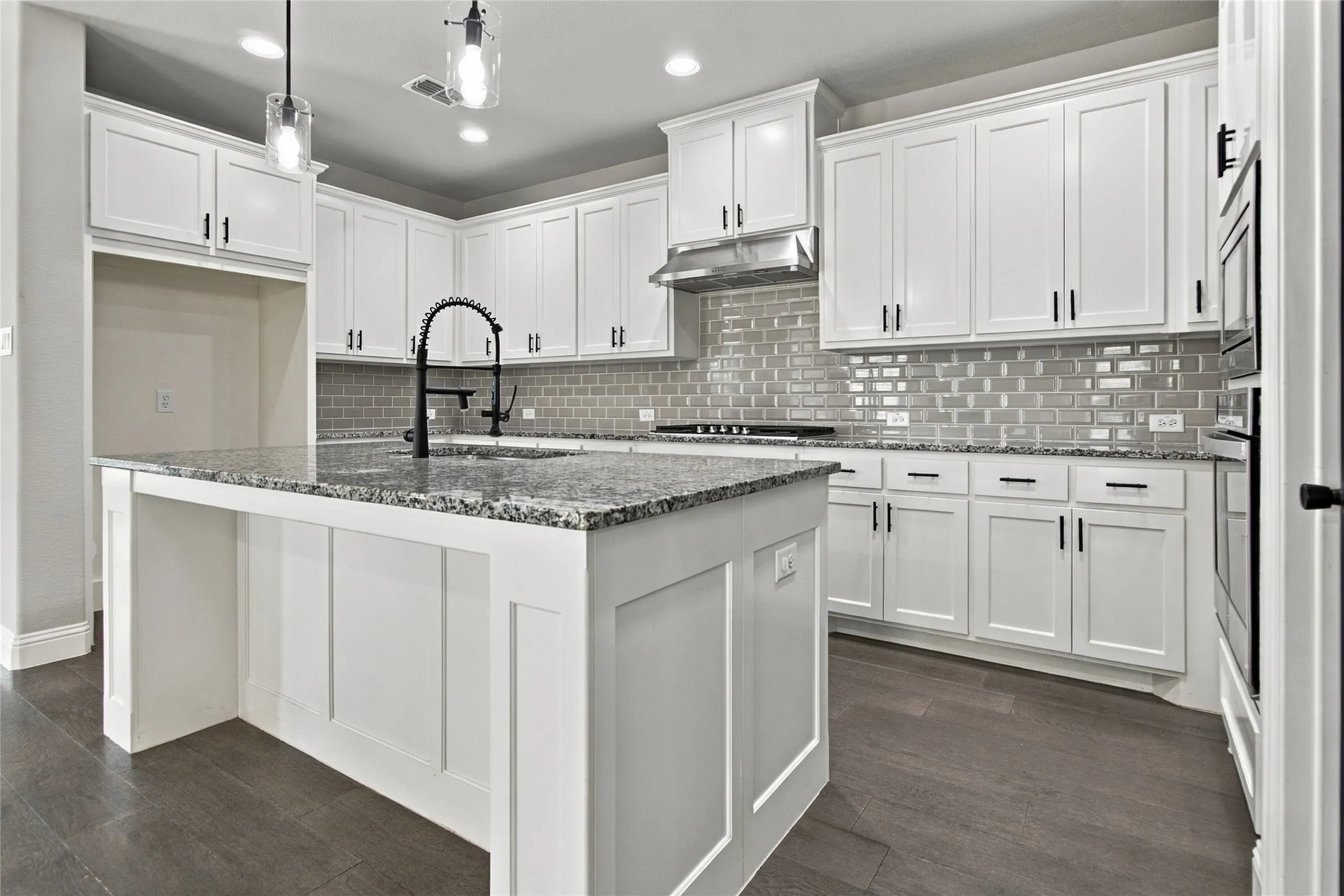 All wood Kitchen island with fashionable subway tile backsplash