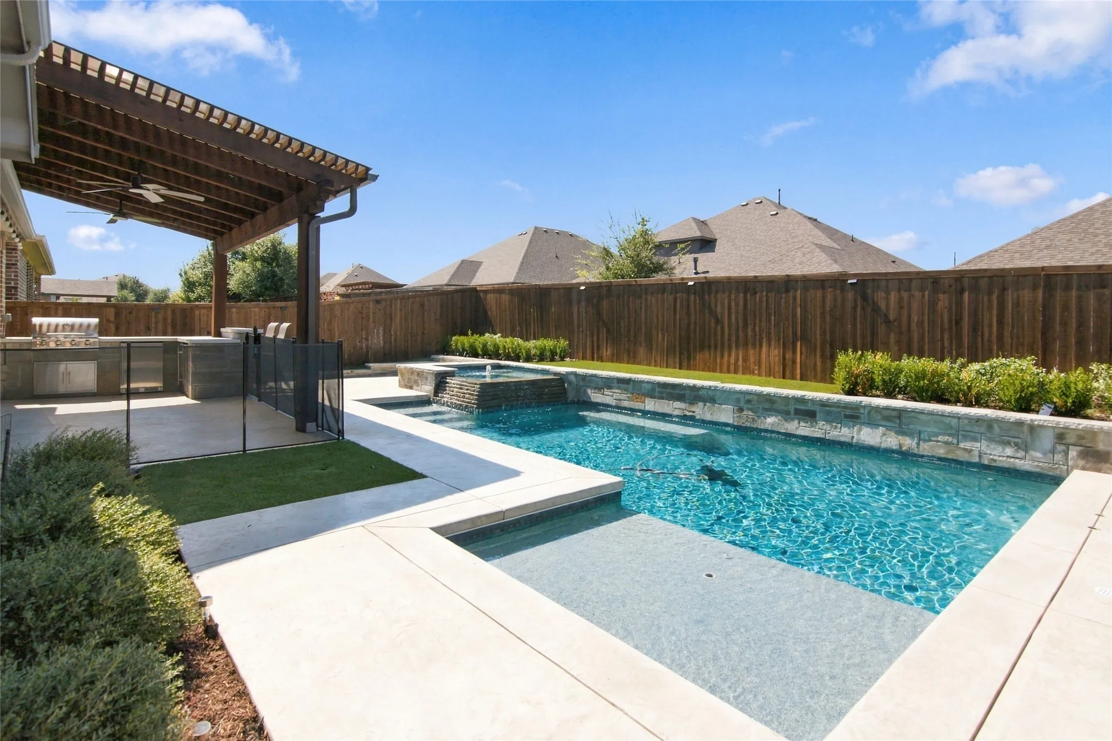Custom salt water pool and spa with water features and lighting