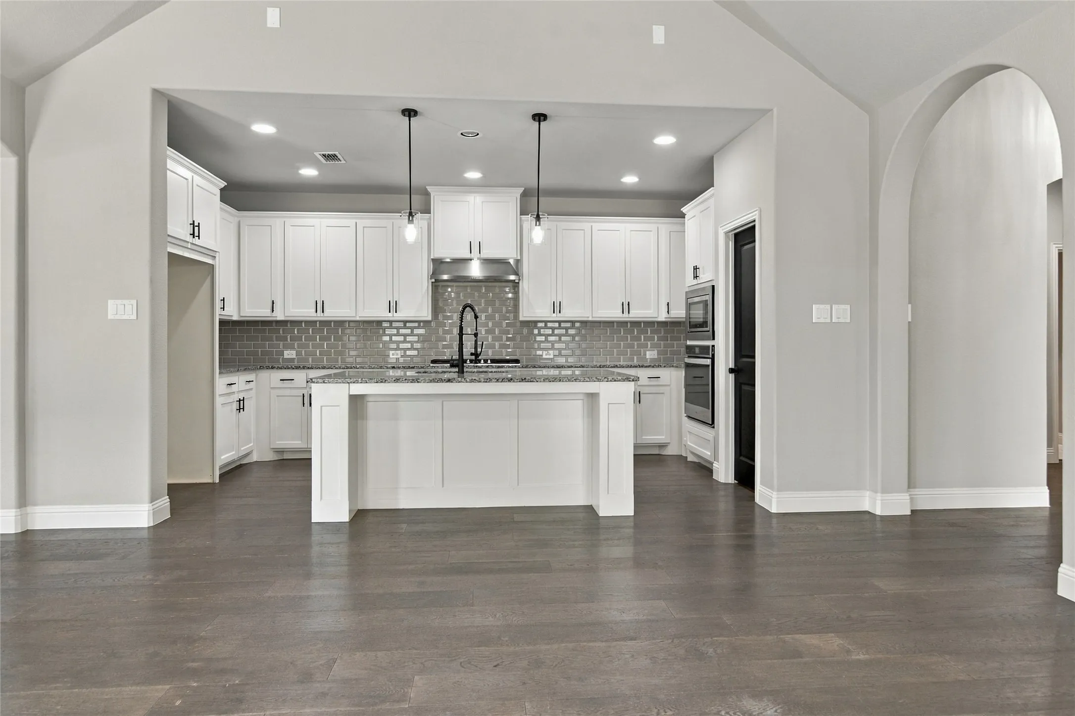 Chef Kitchen with large all island and wall of cabinets