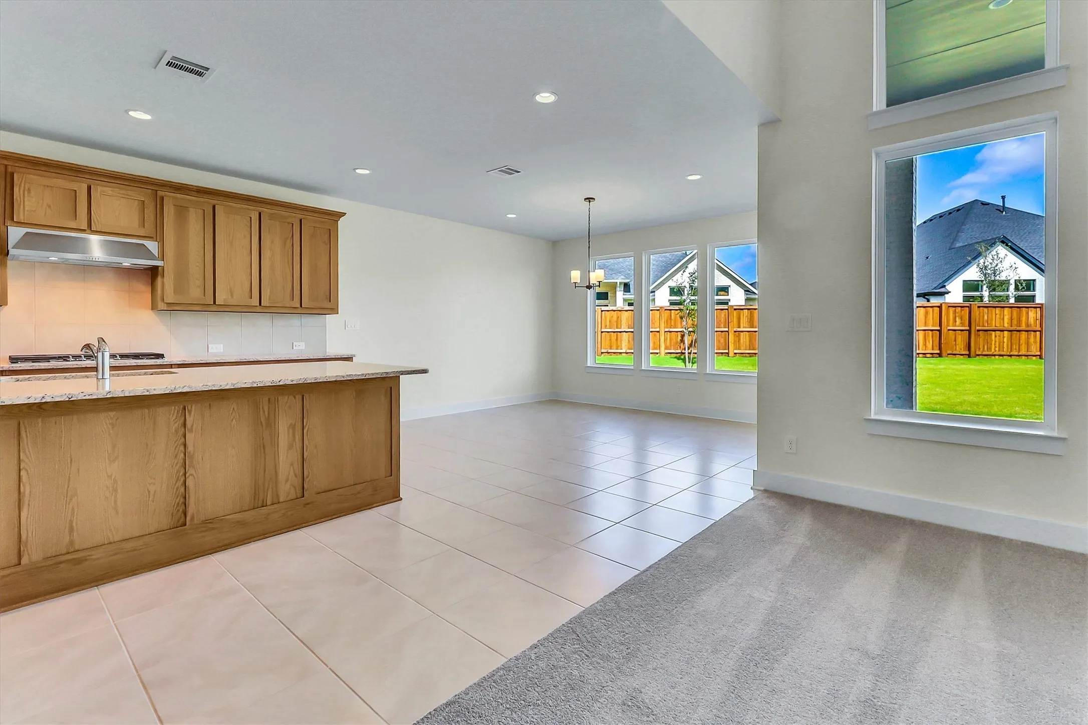 Kitchen island with granite countertop and stainless steel sink