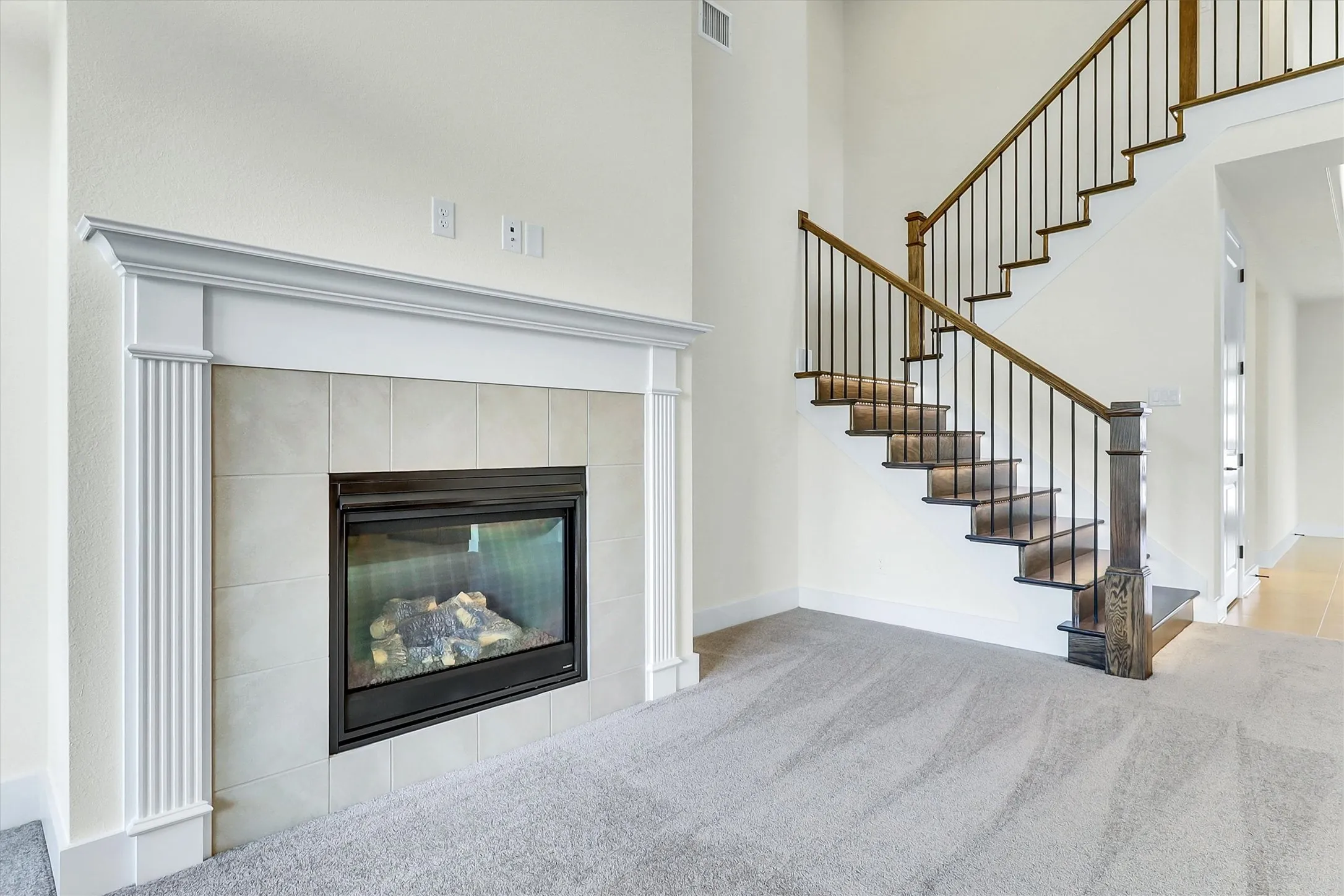 Fireplace with a tile surround and substantial mantel