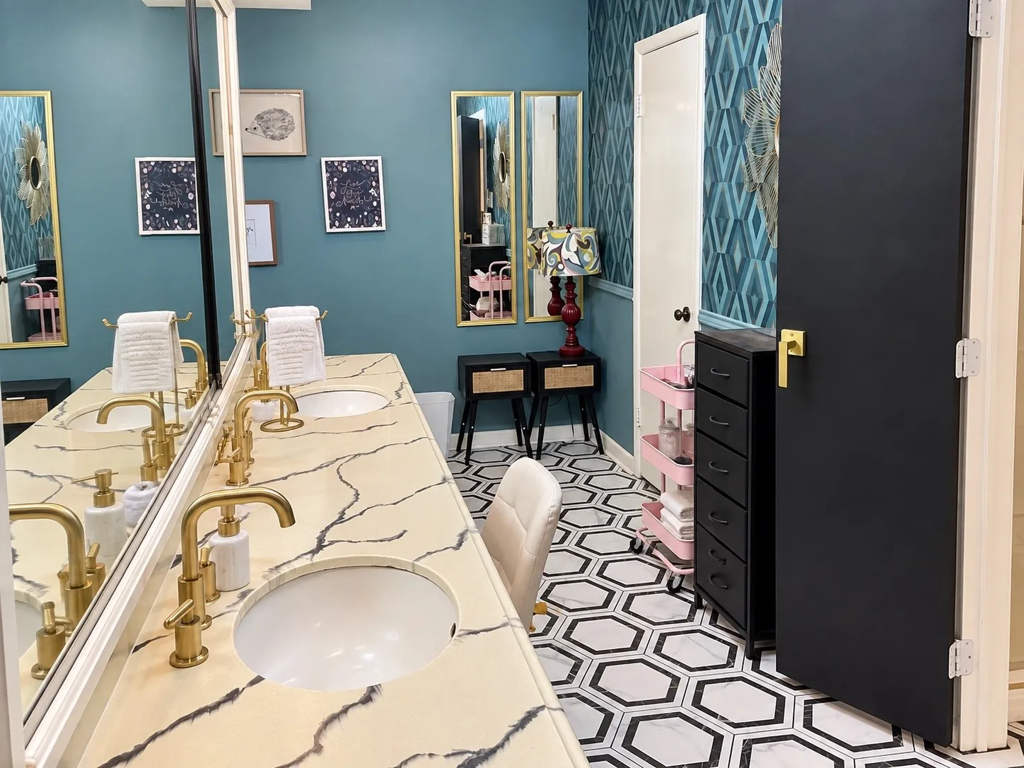 Dual undermount sinks with gold-finish faucets set in a patterned countertop