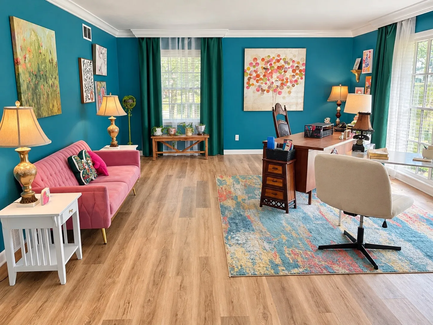 Wood-finish flooring, crown molding, and two large windows with natural light