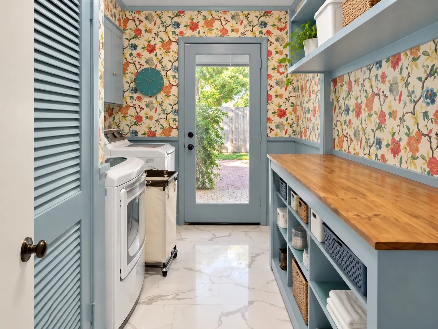 Laundry room with patterned wallpaper, light blue cabinetry, built-in shelving, and wood-finish countertops
