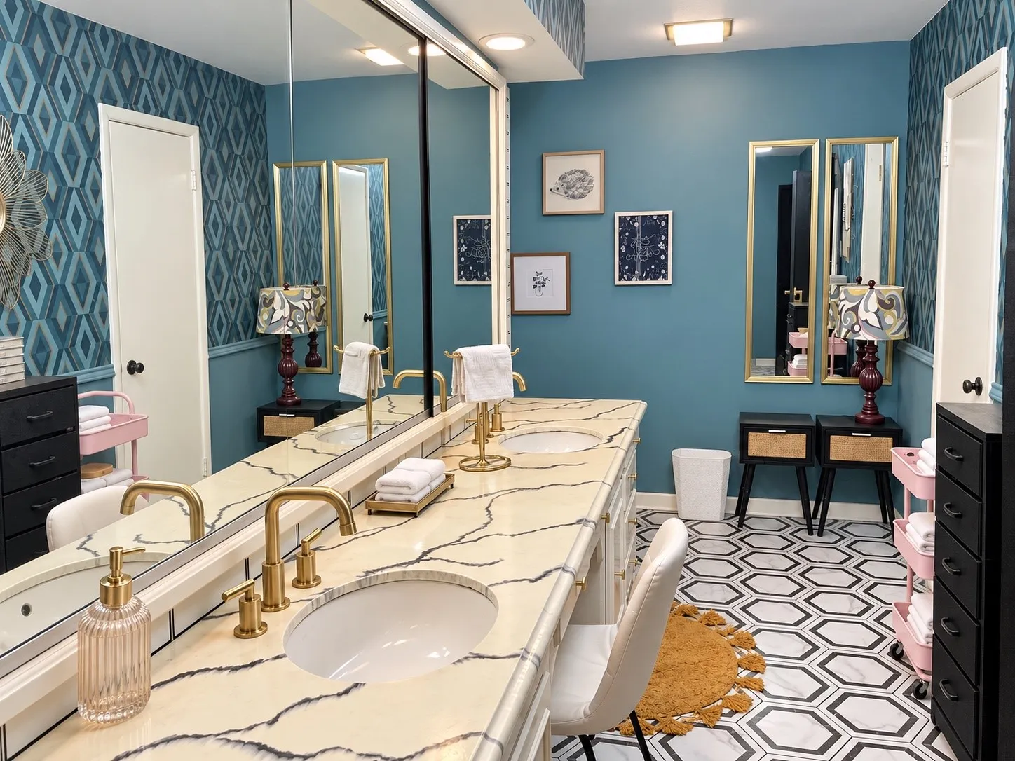 Double vanity with undermount sinks, gold-finish fixtures, and a stone countertop