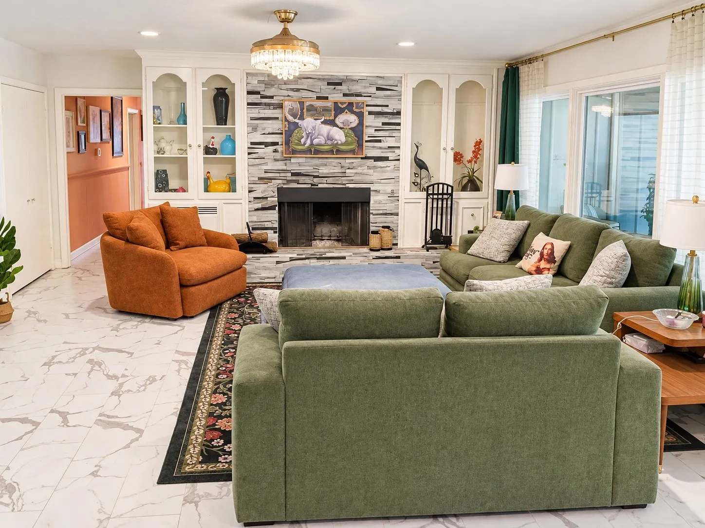 Living area with a stone-clad fireplace and hearth, built-in cabinetry, and tile flooring