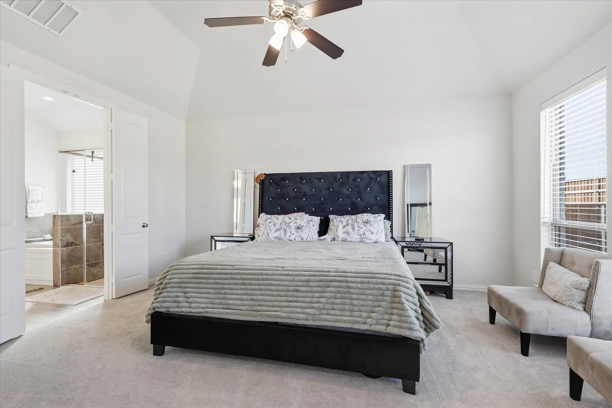 Vaulted ceiling with a ceiling fan, recessed lighting, and soft carpet flooring