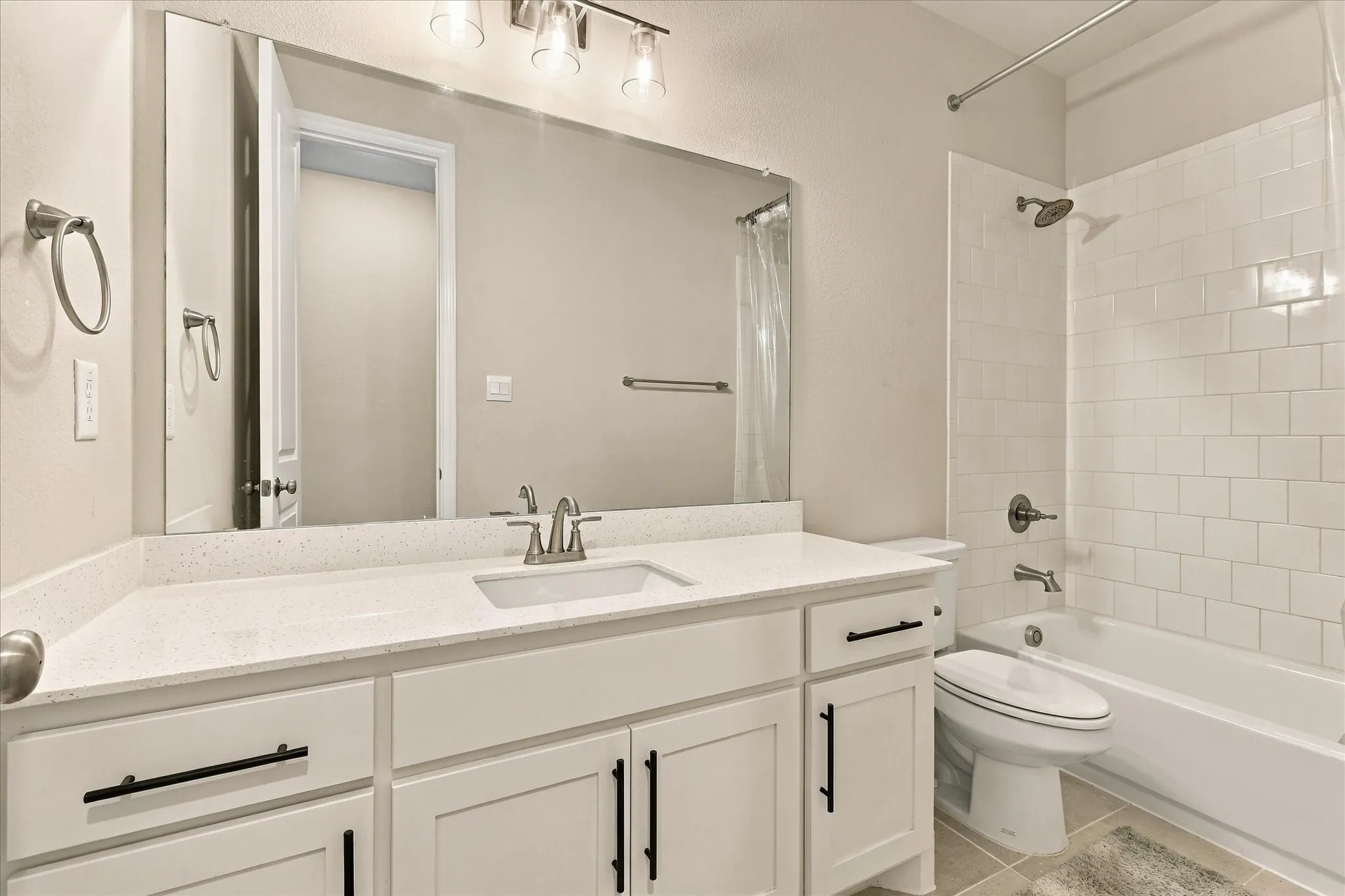 White subway tile surround with a built-in bathtub