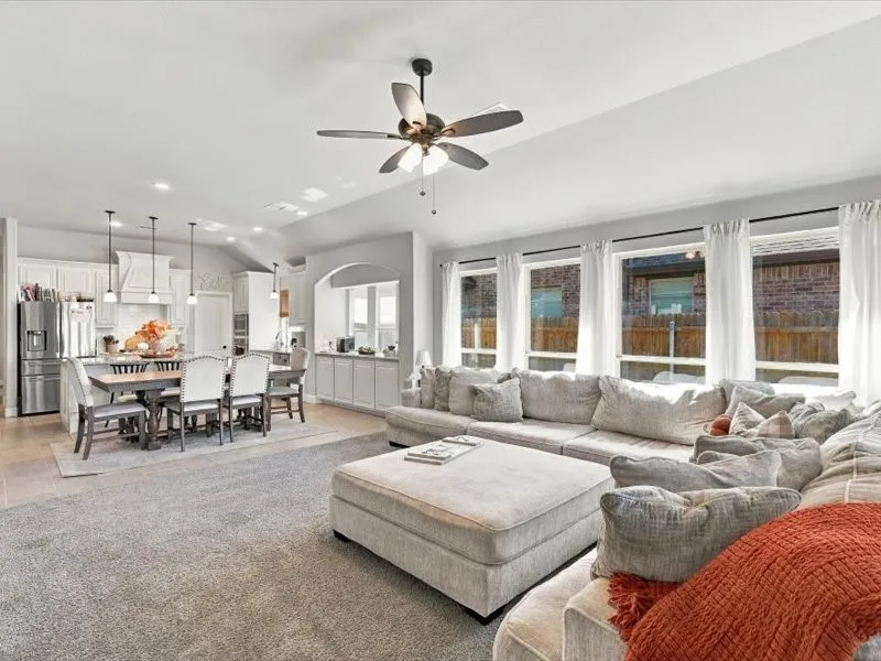 Open-concept interior featuring light gray walls and recessed lighting