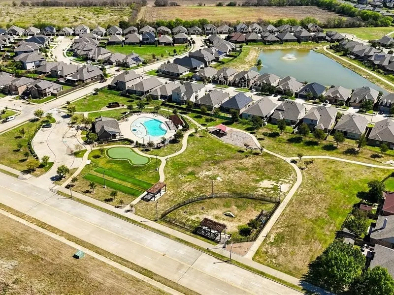 Community amenities featuring a swimming pool, miniature golf area, and sports field