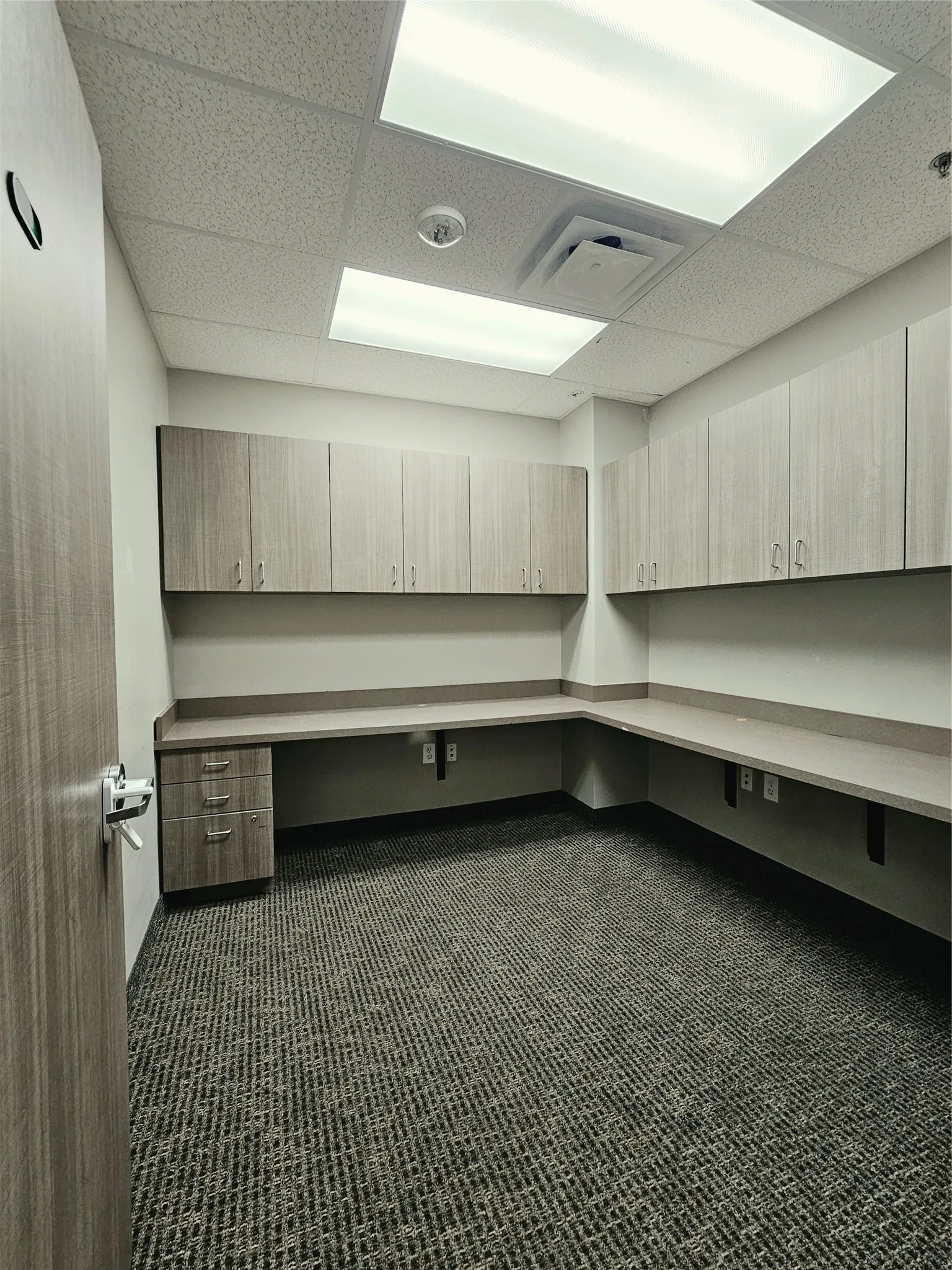 Wraparound built-in desk with integrated storage drawers