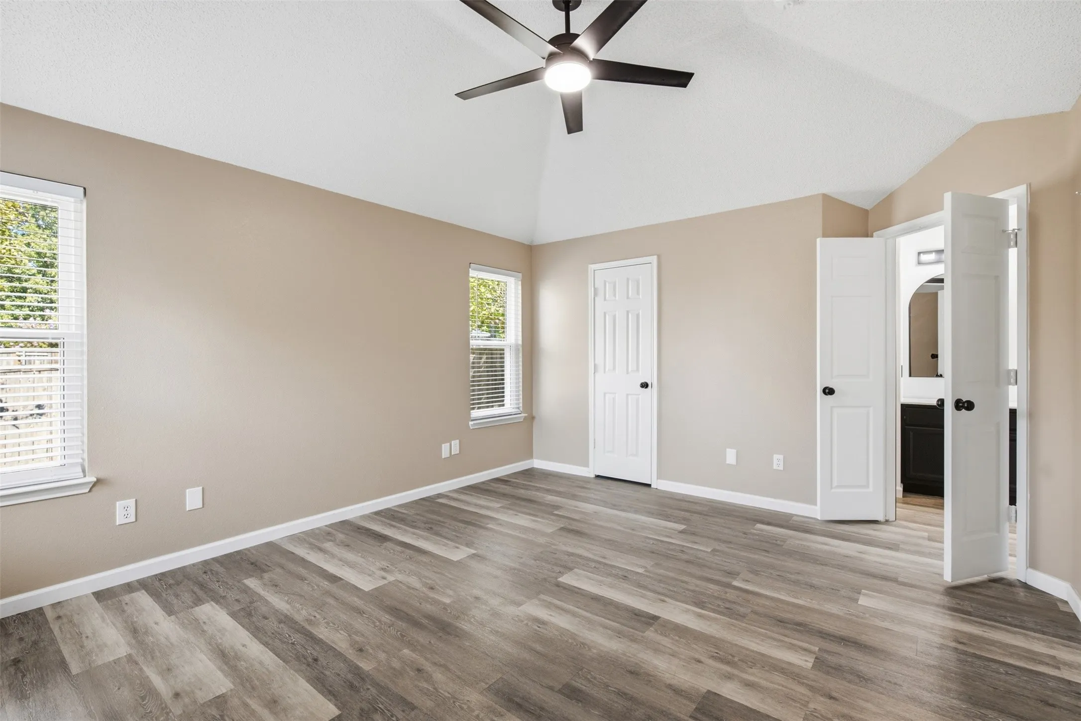 DOUBLE DOORS LEAD TO PRIMARY BATH