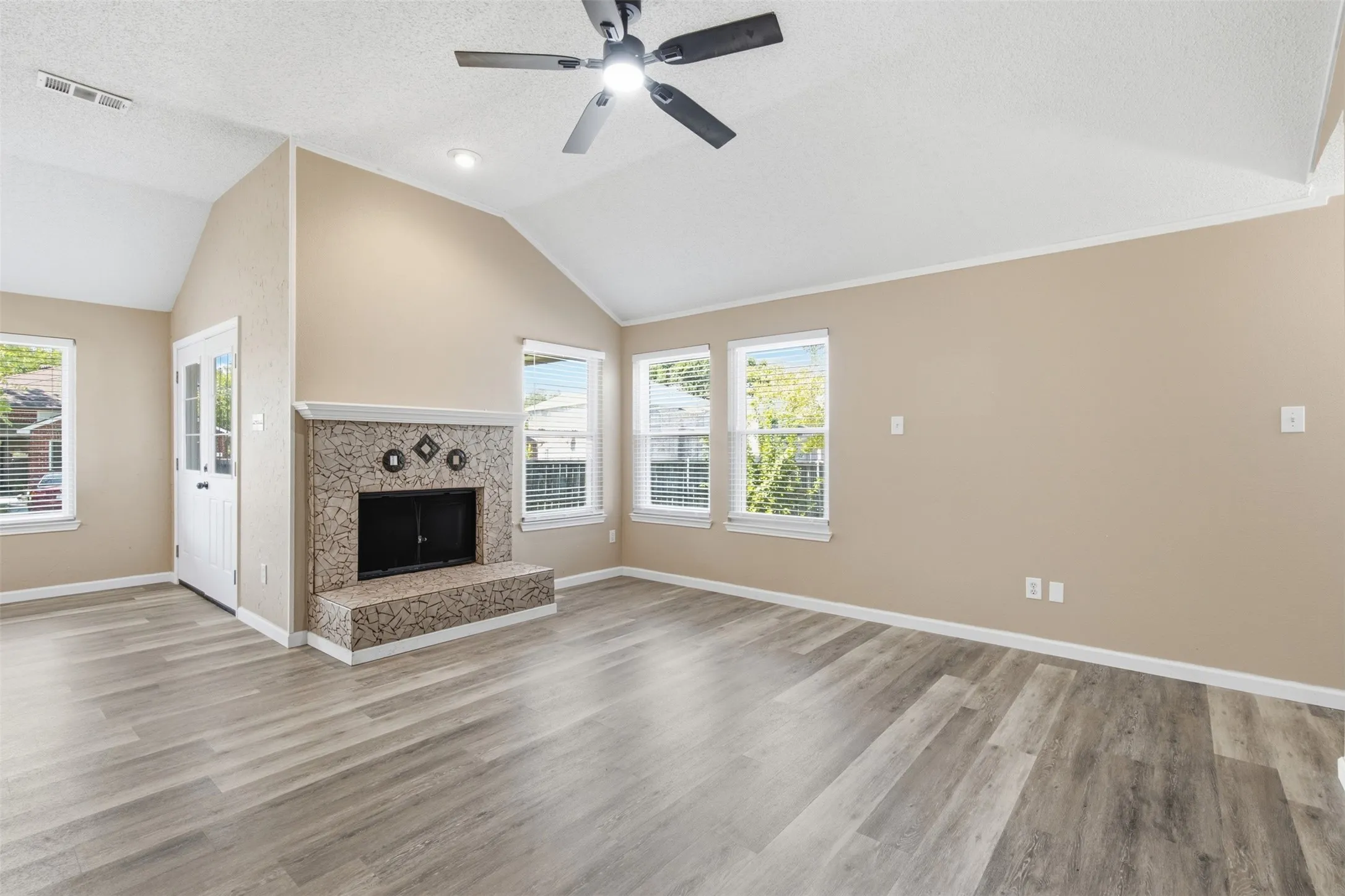 FAMILY ROOM HAS FIREPLACE WITH GAS STARTER