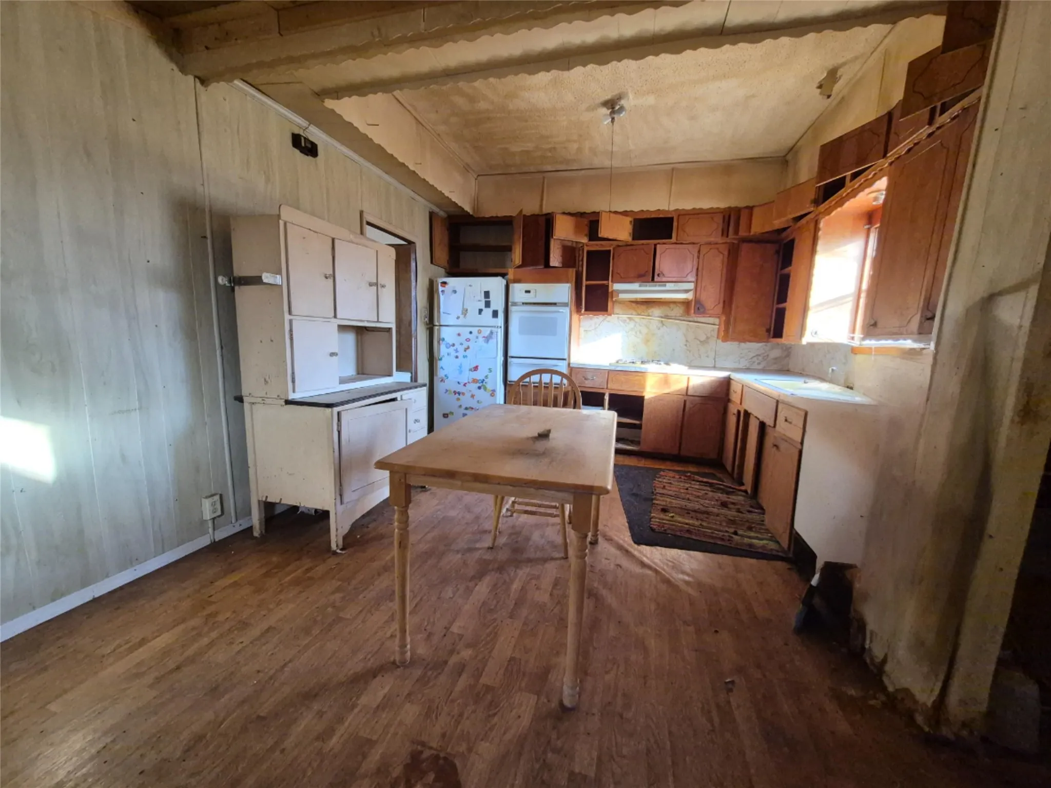 Wood-finish flooring with paneling walls