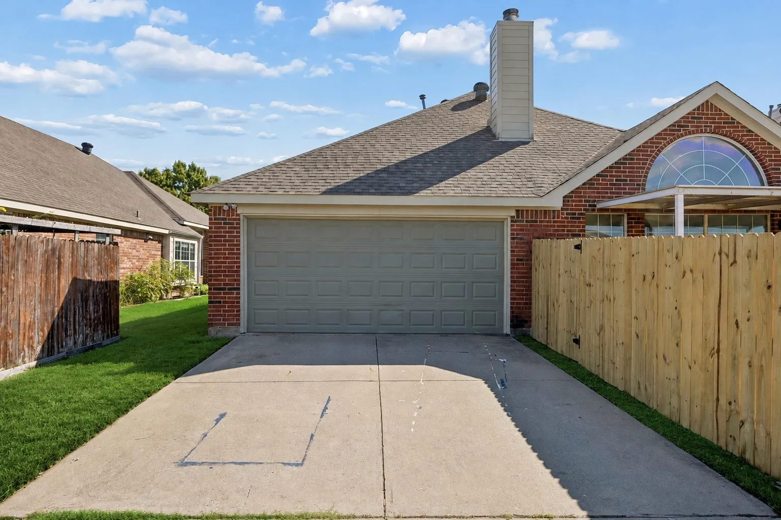 Enjoy the convenience of a two-car rear entry garage, long driveway, and beautifully enclosed backyard setting!