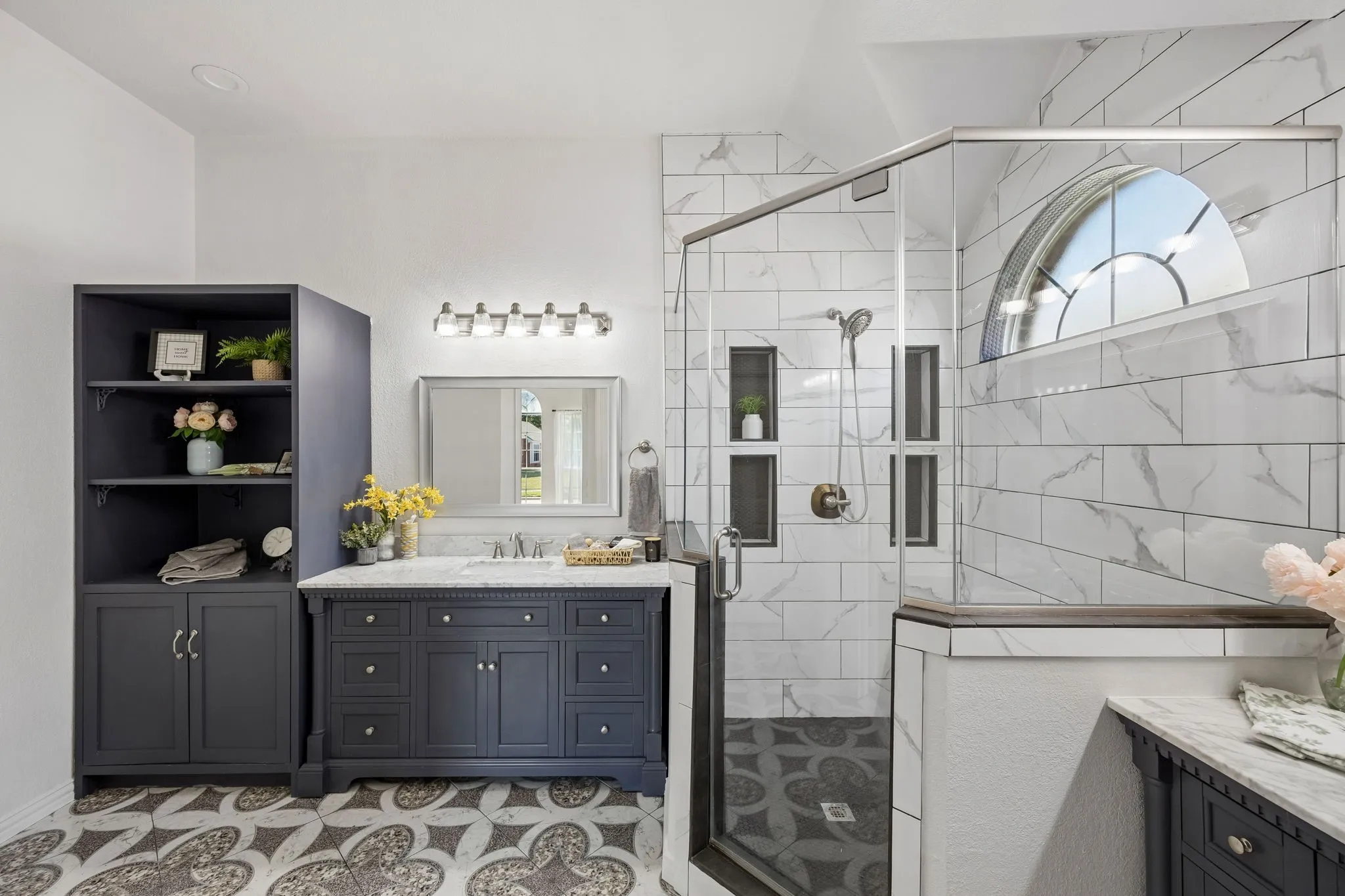 Elegant cabinetry, distinctive designer-inspired flooring, and a beautifully tiled walk-in shower create  a relaxing, refined atmosphere!