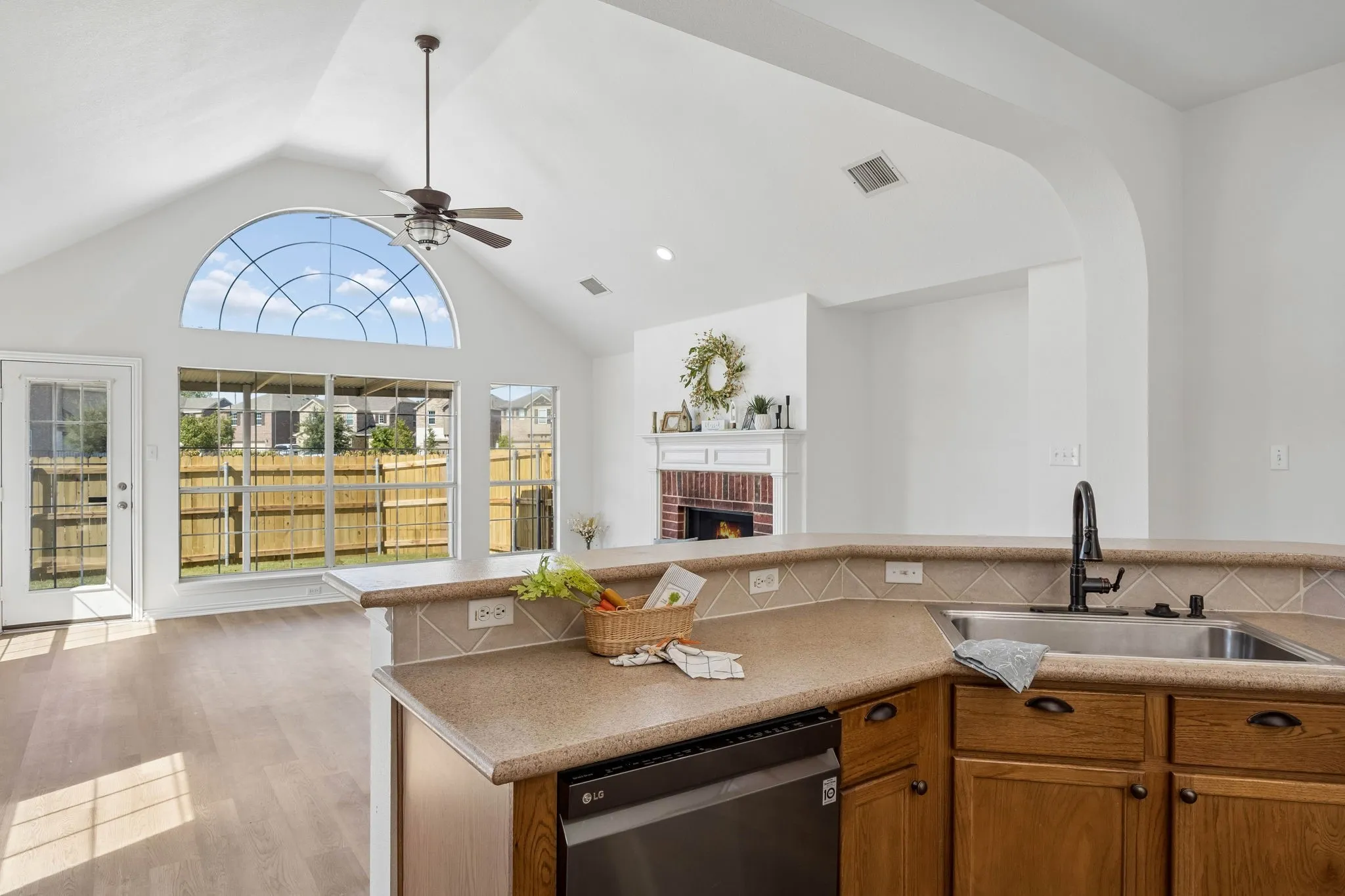 Just another awesome look at the expansive and breathtaking windows, vaulted ceiling and warm and inviting fireplace in the Living area... WOW!  So Inviting!