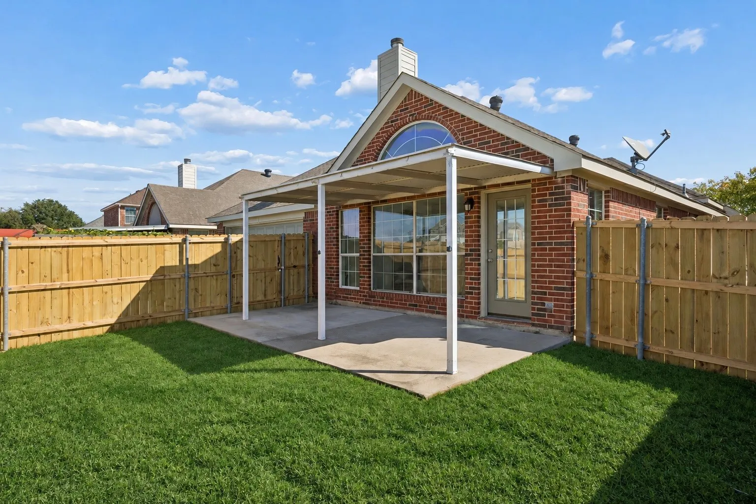 Your own private outdoor retreat!  Relax beneath the covered patio while enjoying the spacious backyard!