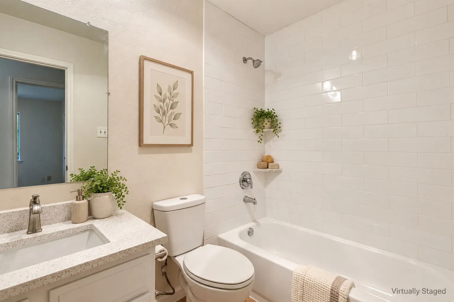 White subway tile shower surround with a built-in tub