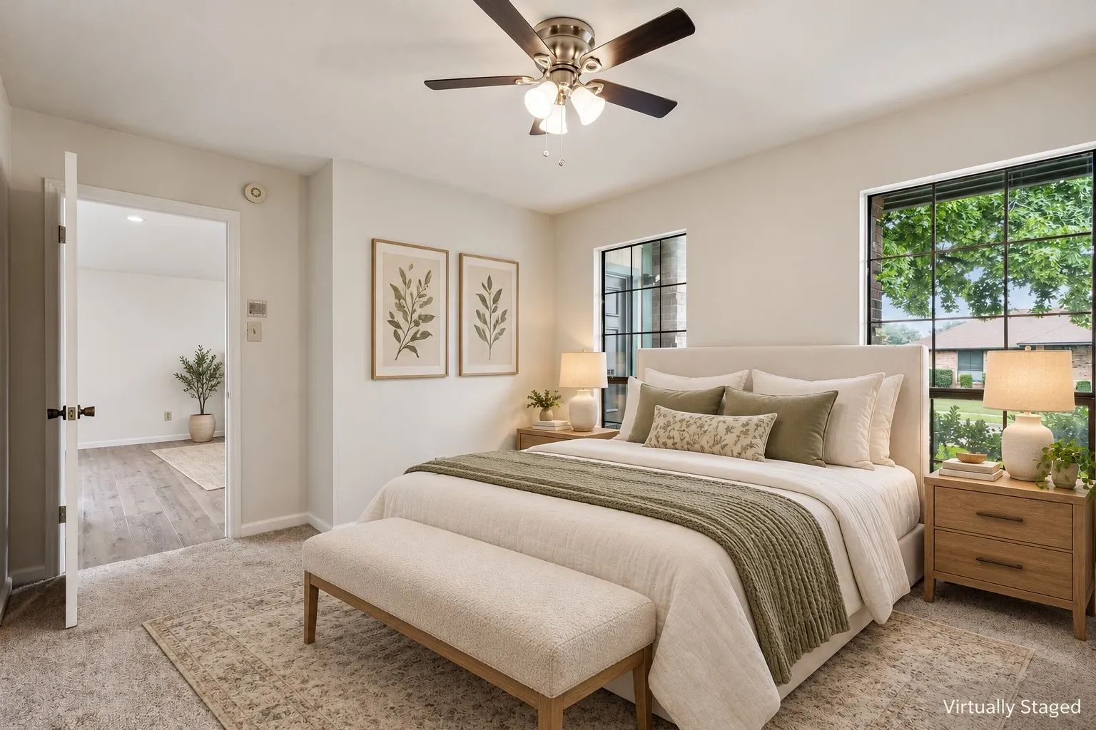 Carpeted flooring, ceiling fan with integrated lighting, and two large windows with black frames