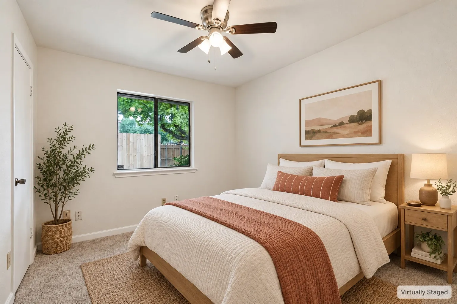 Carpeted flooring, ceiling fan with integrated lighting, and a single window