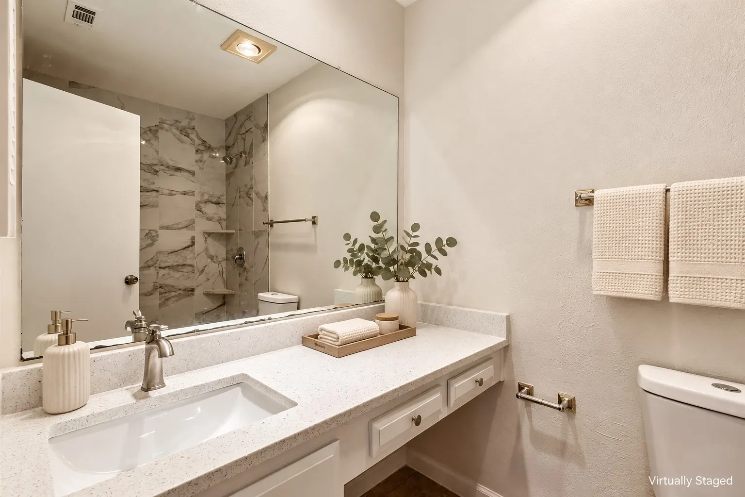 Extended vanity featuring an integrated rectangular sink and brushed nickel faucet