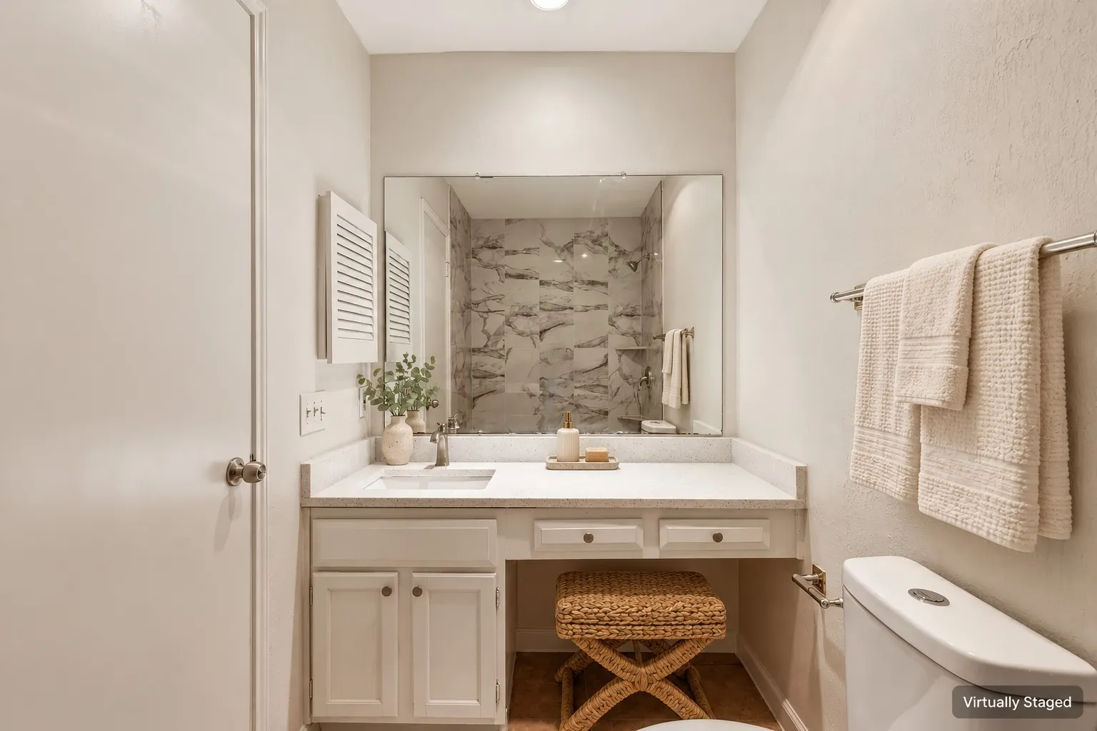Vanity with an integrated sink, polished chrome faucet, and ample counter space