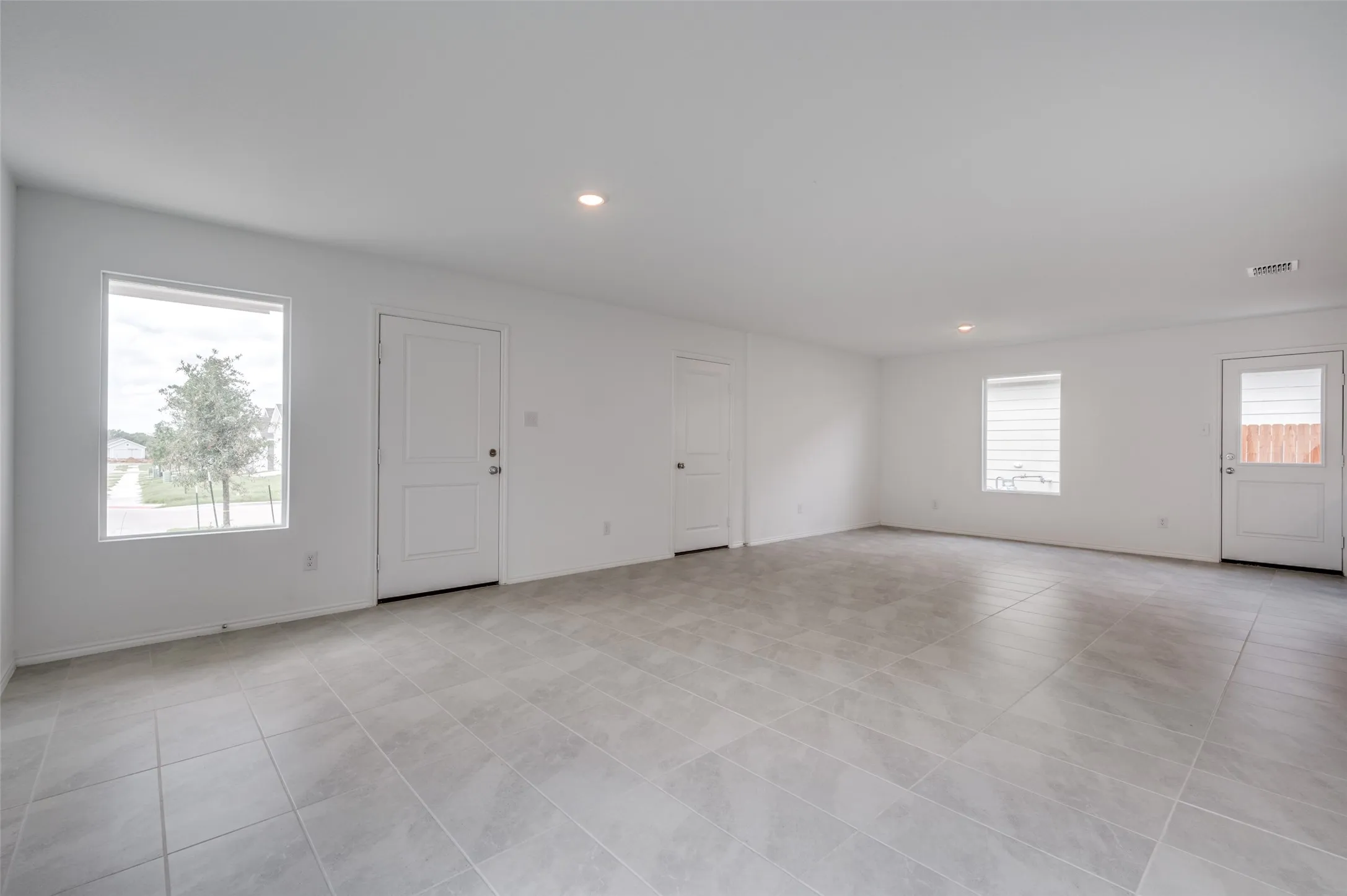 Spare room featuring light tile floors