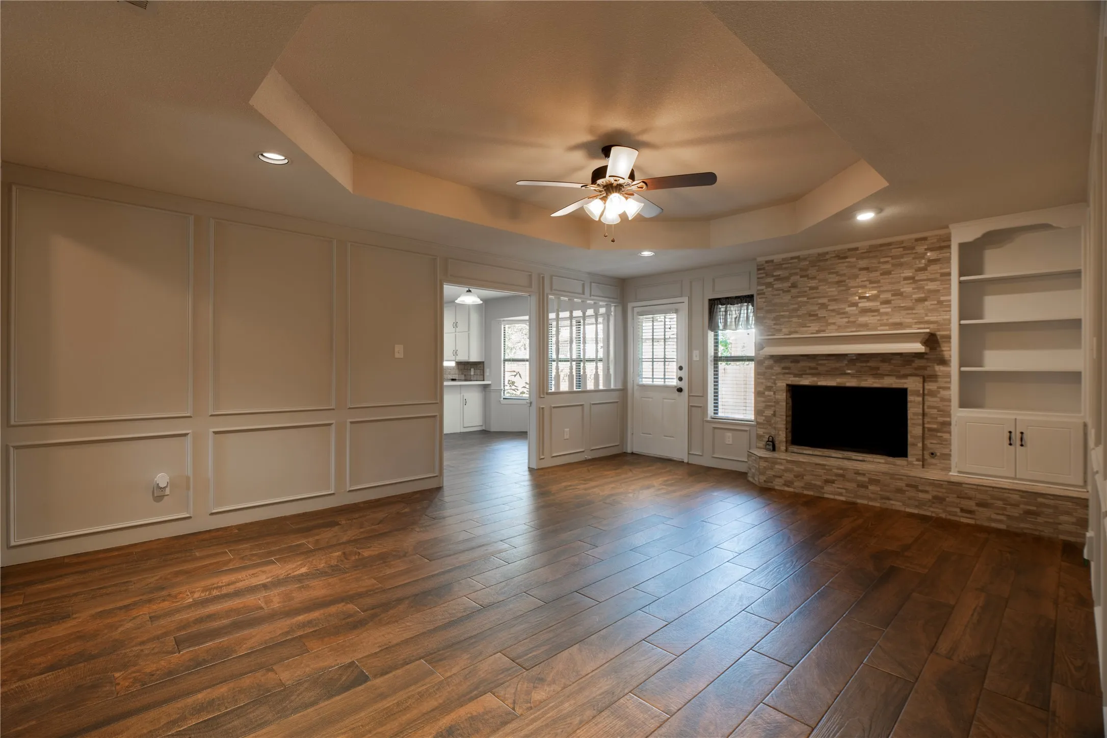 Well maintained and beautiful home - with gorgeous wood-look tiles and features a wood burning fireplace and bookshelf
