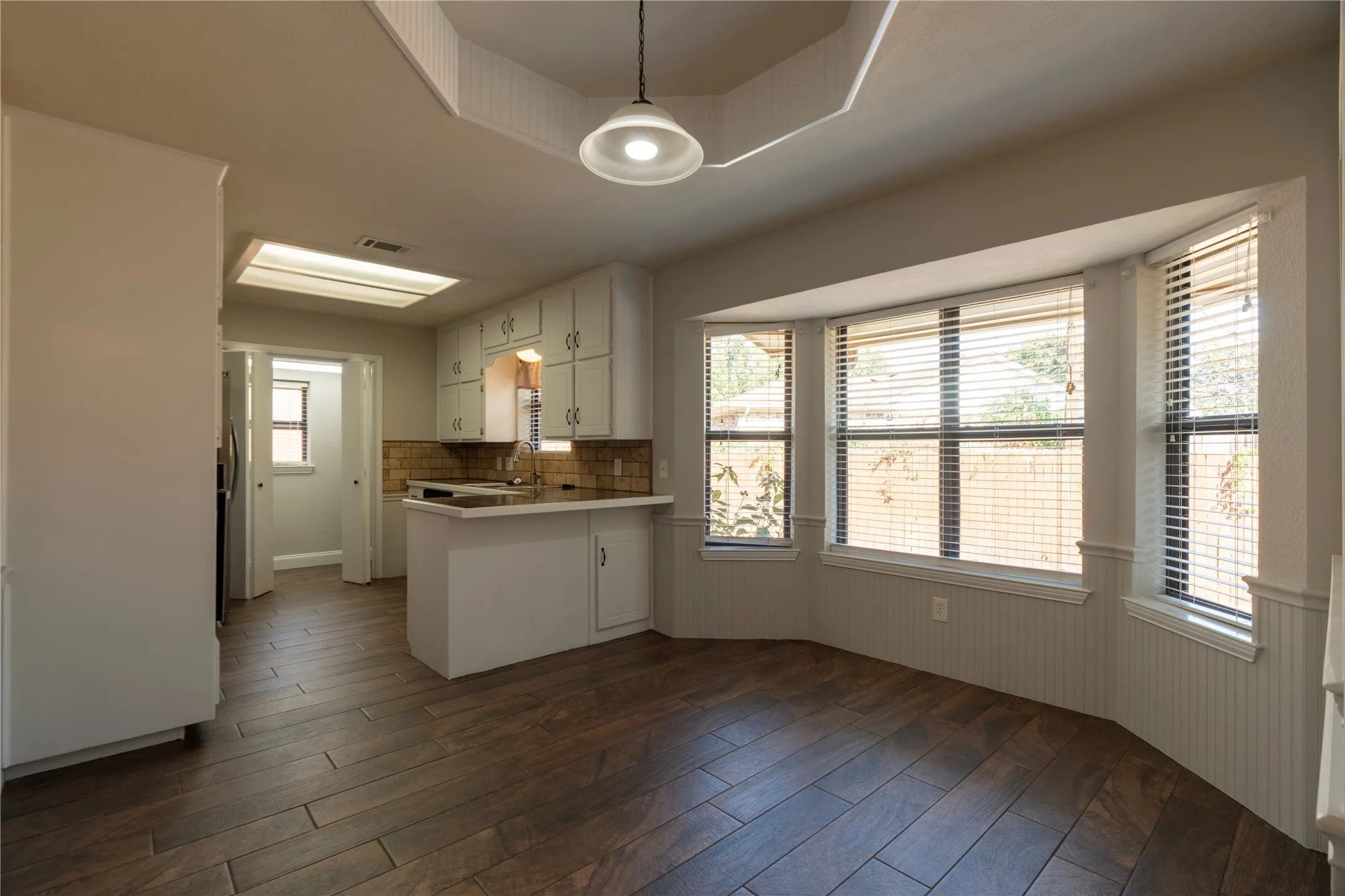 Beautiful wood-look tile in the large dining area