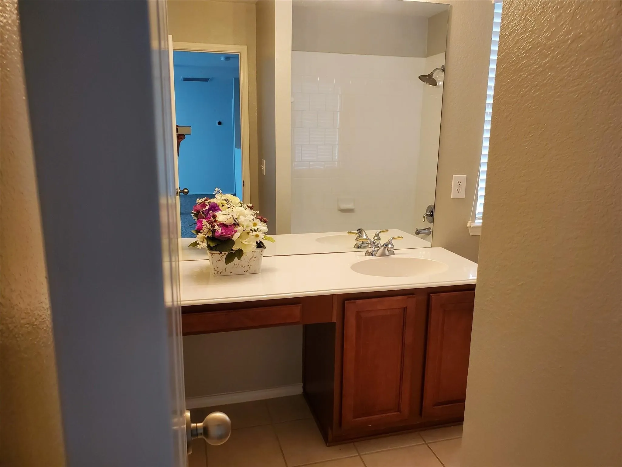 Bathroom featuring vanity and tile patterned flooring