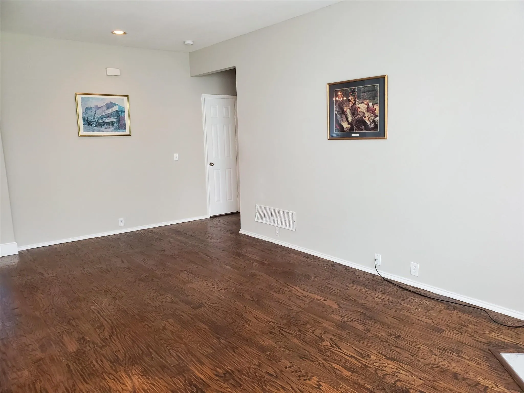 Spare room featuring dark hardwood / wood-style flooring