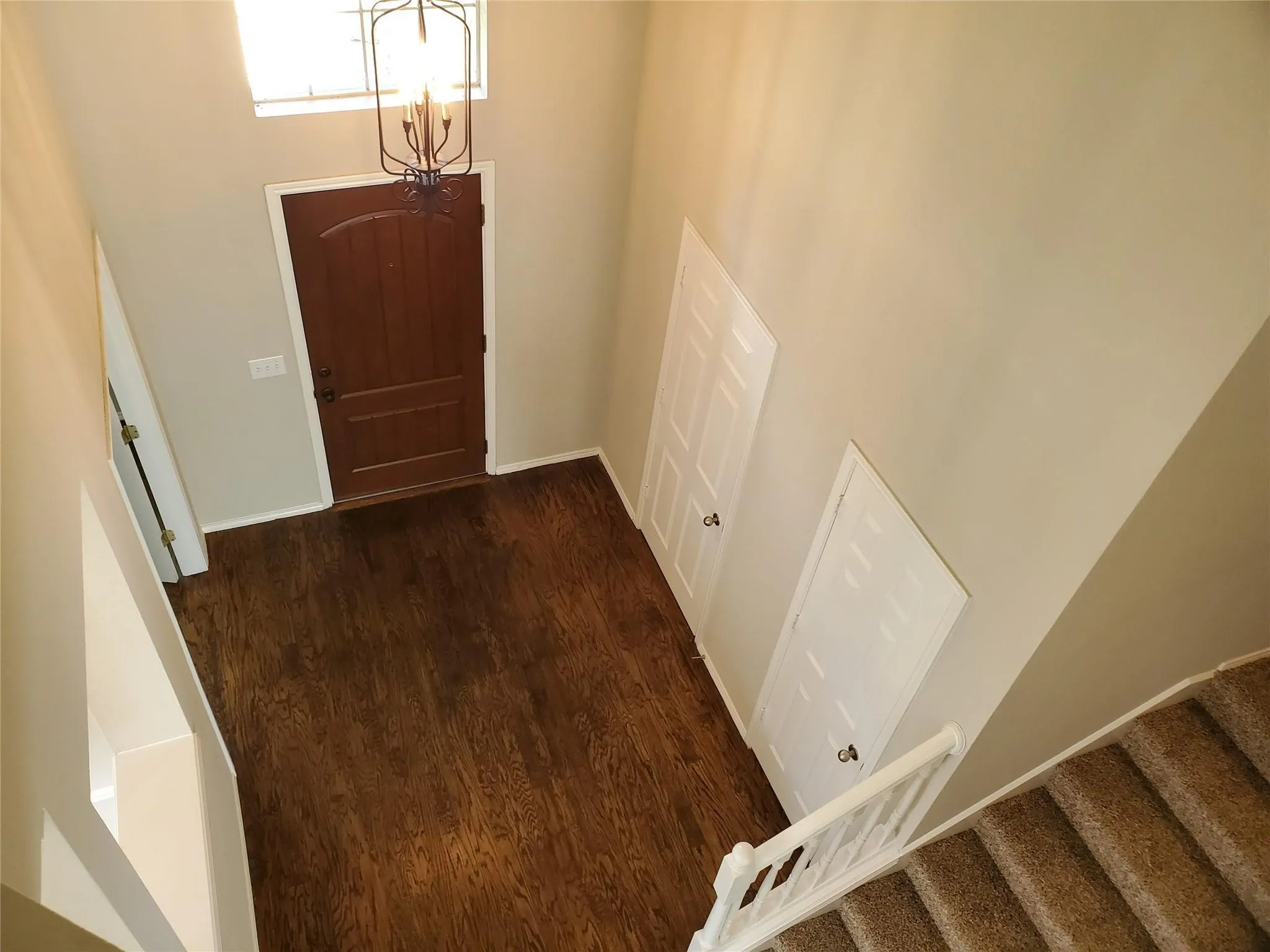 Foyer entrance with dark hardwood / wood-style flooring