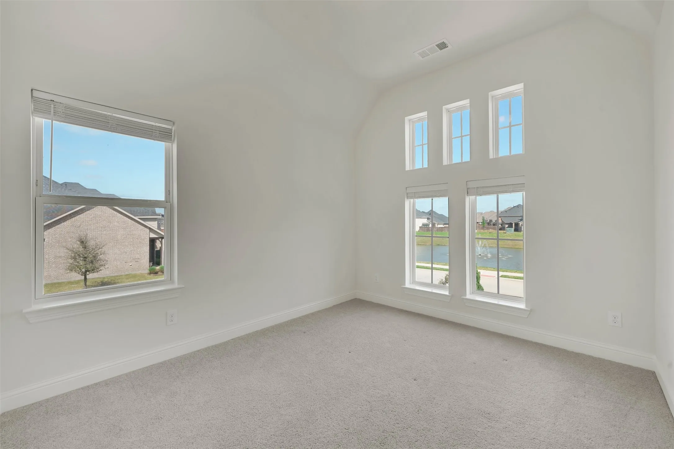 High ceilings with multiple windows, providing abundant natural light