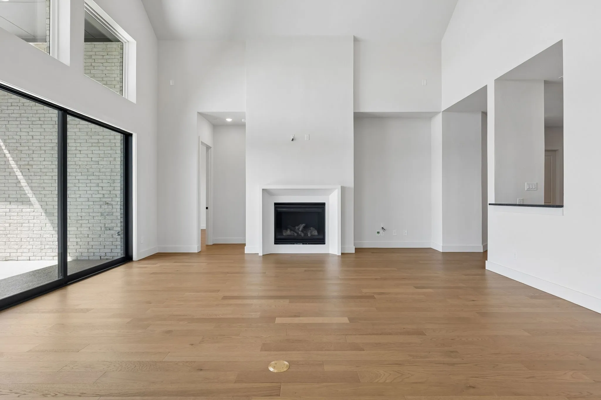 You'll enjoy a spacious family room featuring high ceilings, beautiful flooring, cozy fireplace and a wall of windows in our over the top Madison II plan!
