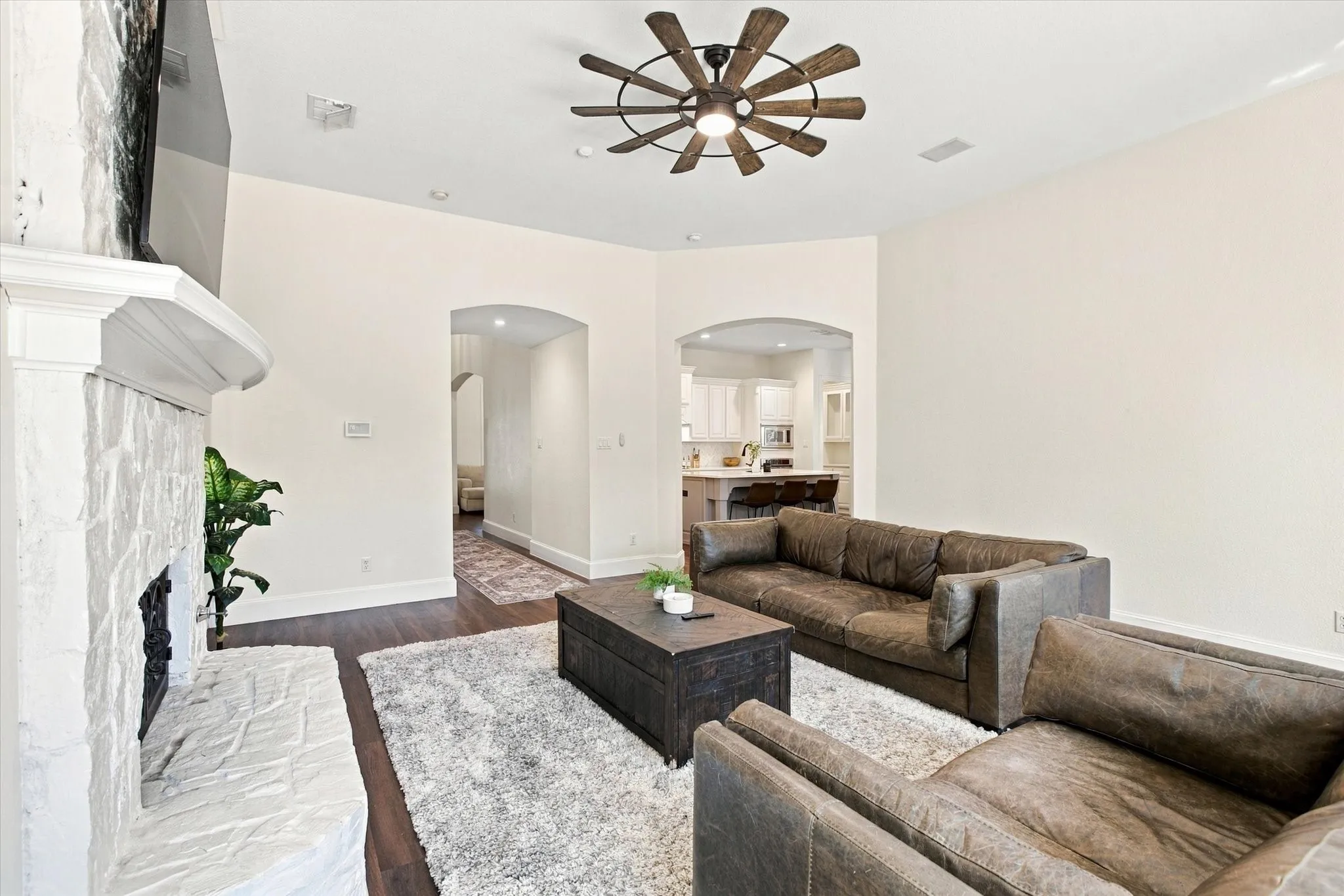 Vaulted ceiling with a rustic-style ceiling fan