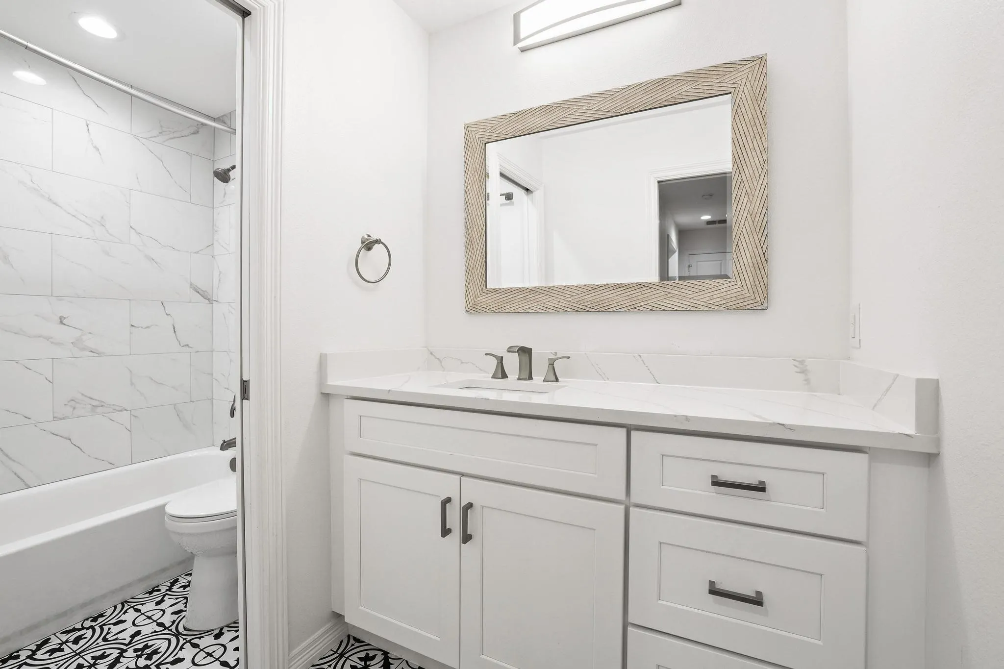 Downstairs Bedroom 3, Neutral tone carpeting, white walls, ceiling fan with light, recessed lighting, and a window with a white frame