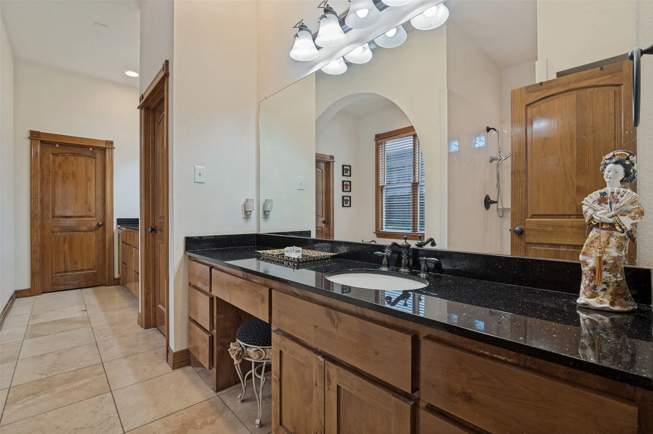 Primary bath with a makeup vanity and a separate shower