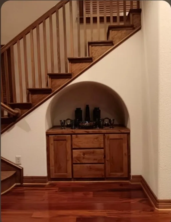 Arch built-in under the staircase, wit custom alder cabinets