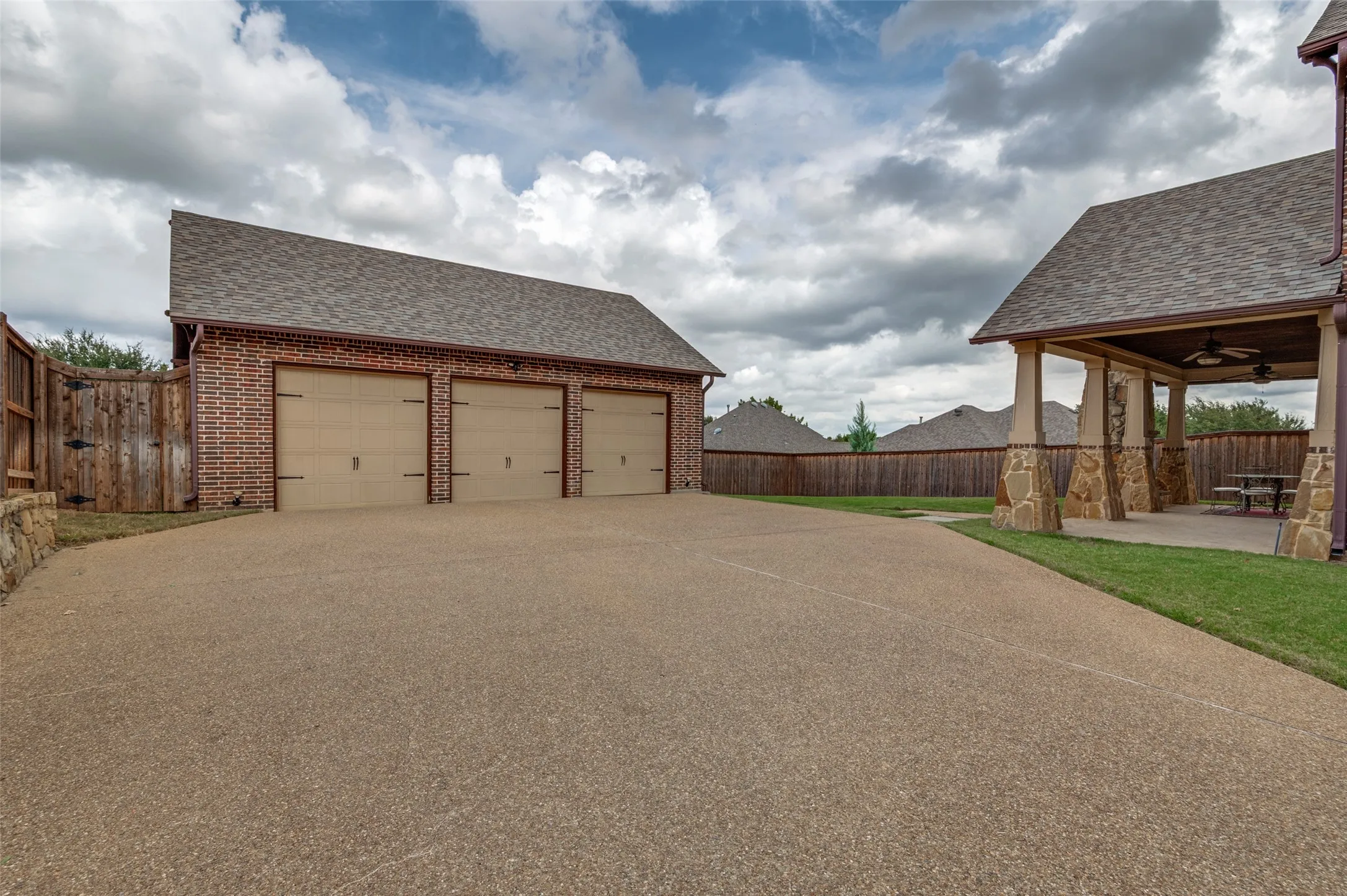 Oversized detached 3-car garage with an extended driveway