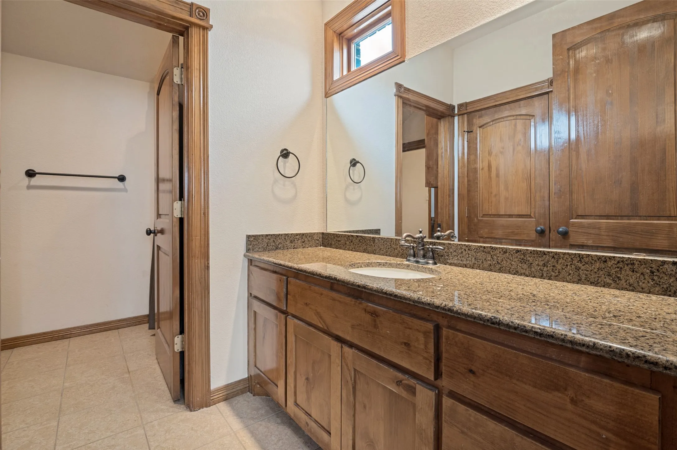 Jack and Jill bath with a granite vanity