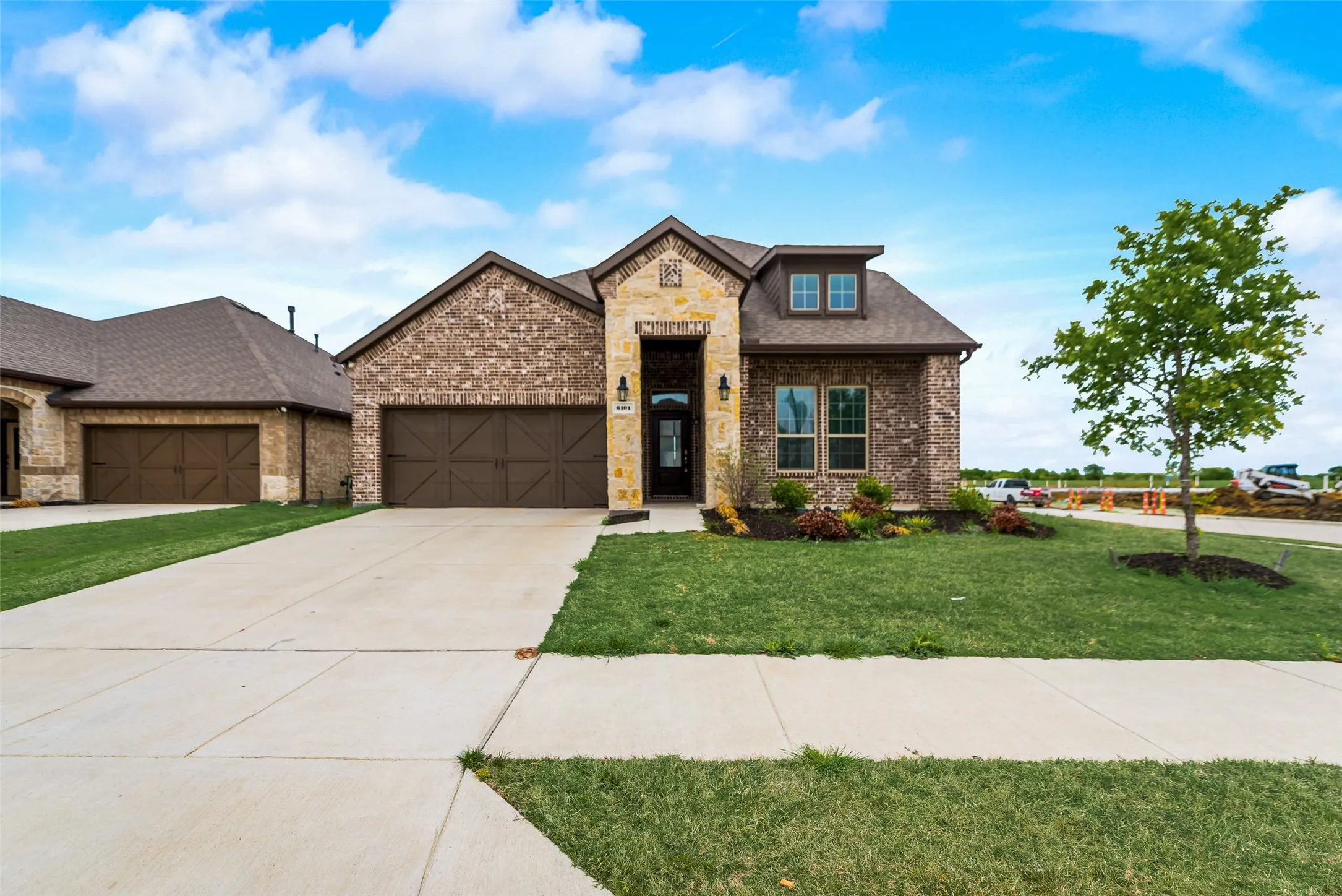 Brick and stone exterior with architectural shingles