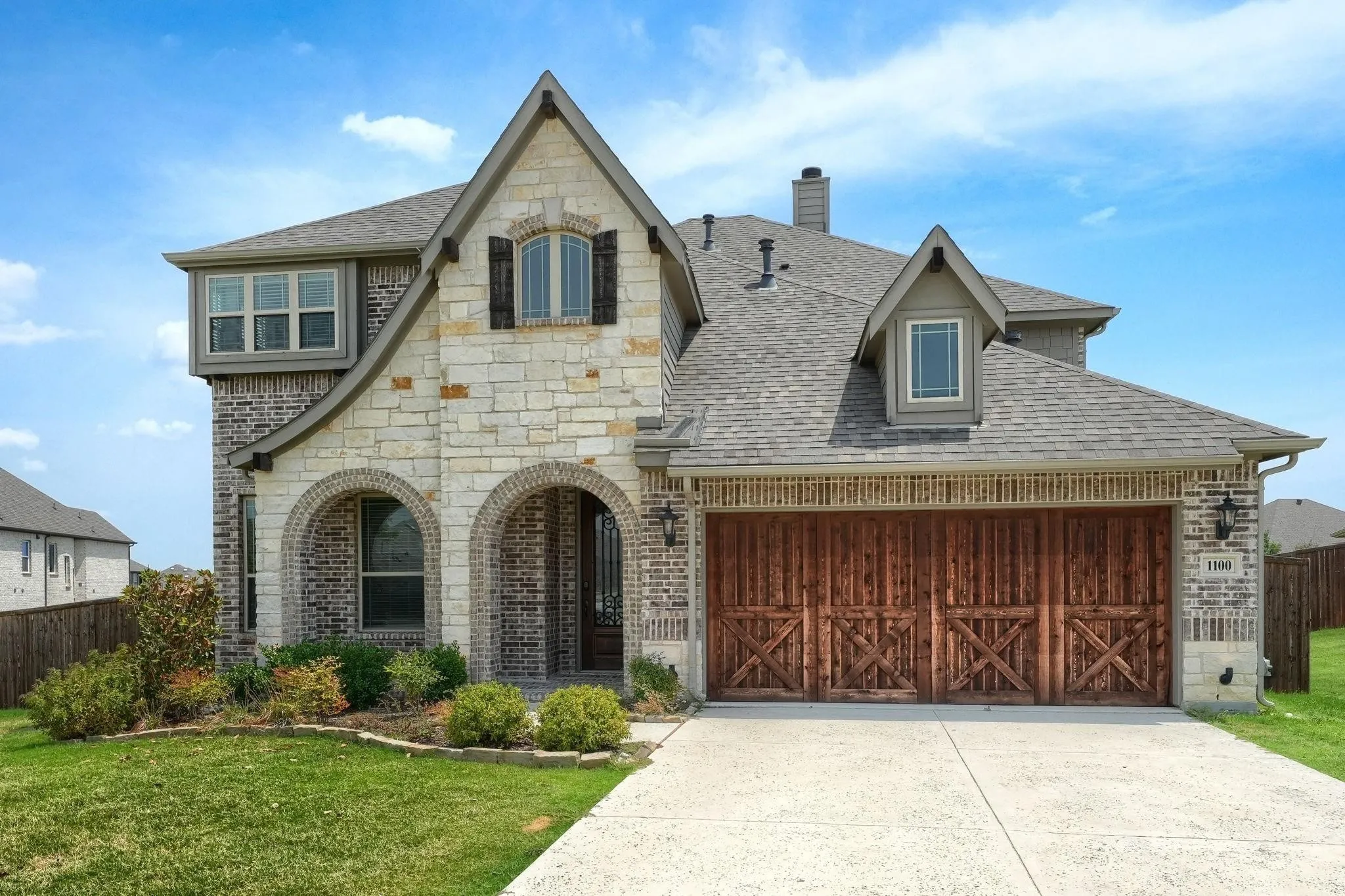 Stone and brick exterior with arched entryway