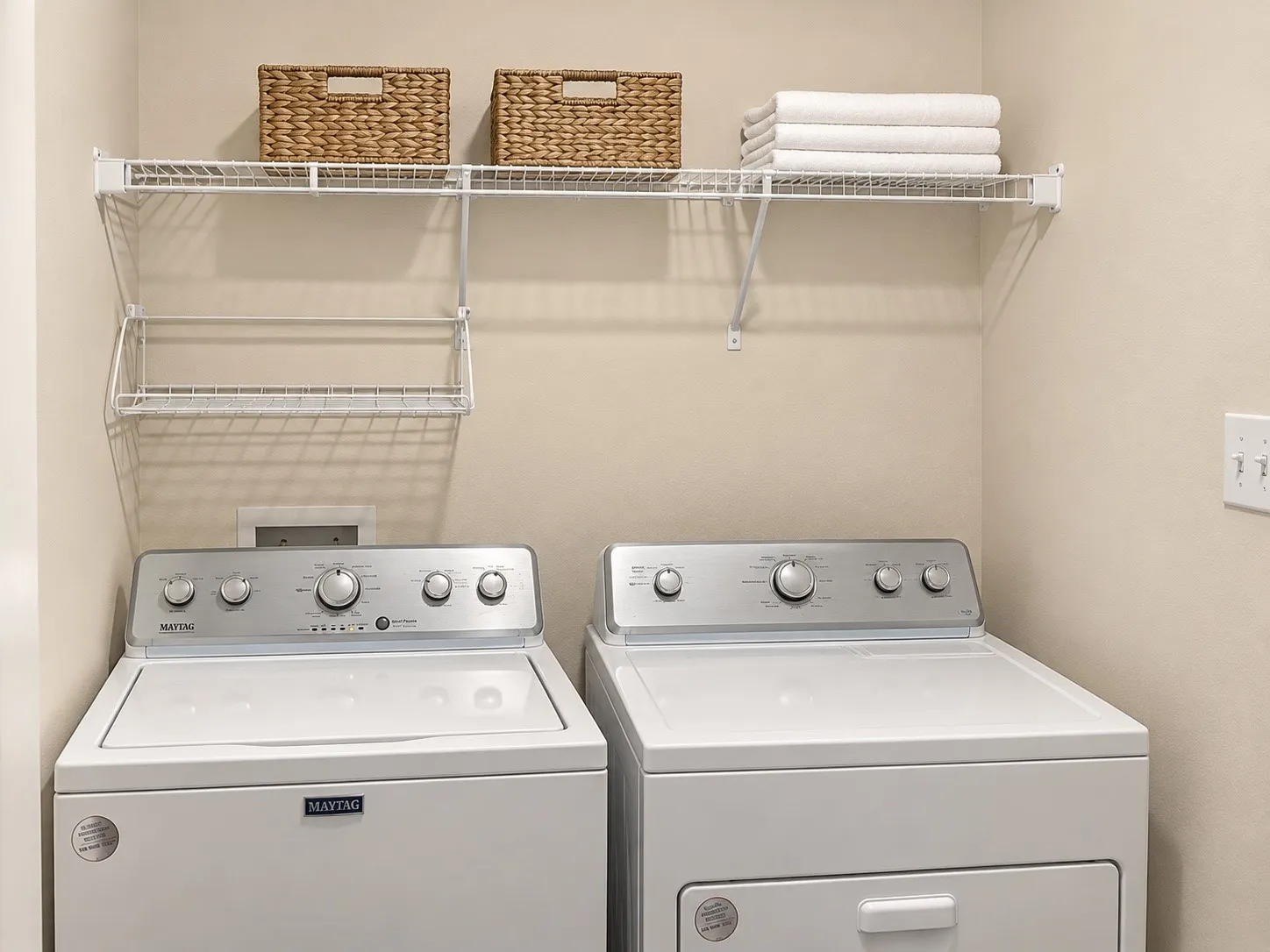 Integrated laundry appliances with white top-load washer and front-load dryer