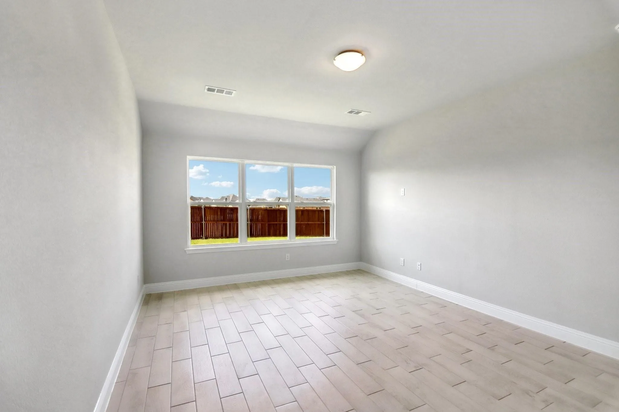 Recessed lighting, wood-finish flooring, and multiple windows